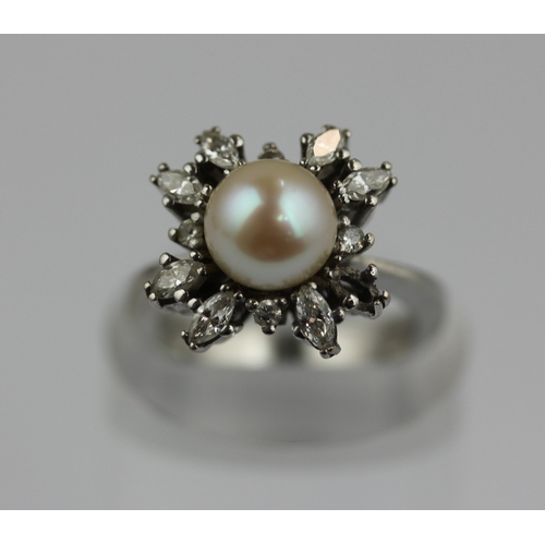 517 - A diamond and cultured pearl cluster ring, mounted with marquise and circular cut diamonds surroundi... 