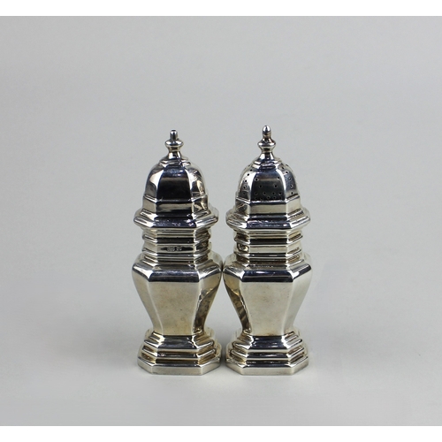 66 - A pair of modern silver octagonal salt and pepper cruets baluster shape with slide on tops, maker Ed... 