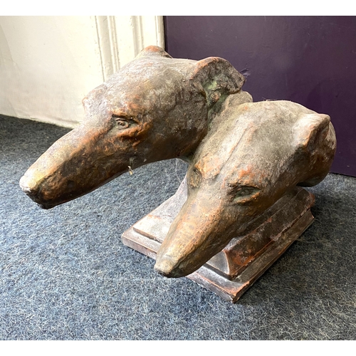 774 - A bronzed reconstituted stone sculpture of two Greyhounds heads, on plinth base, 28cm high, (af).