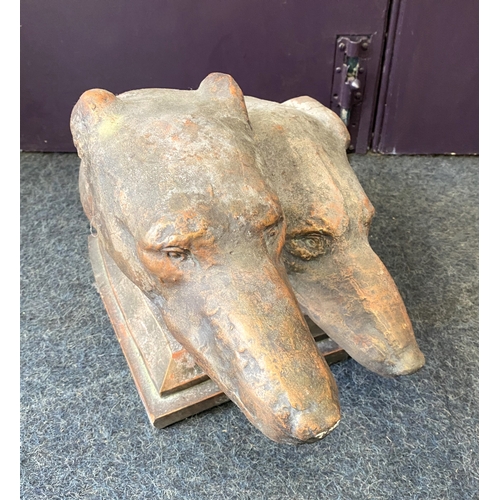 774 - A bronzed reconstituted stone sculpture of two Greyhounds heads, on plinth base, 28cm high, (af).