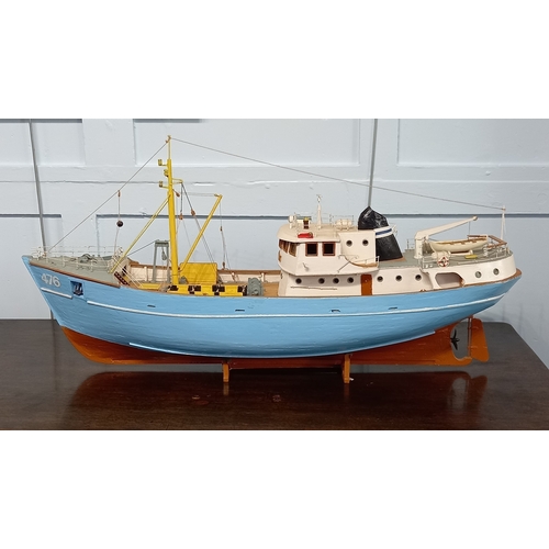 779 - A 1:50 scale wooden model of a North Sea trawler, Nordkap 476 on rest, 82cm