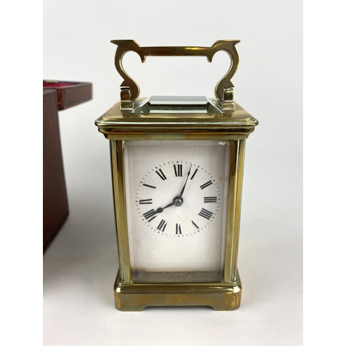 792 - A gilt brass and bevelled glass cased carriage clock, the white enamel dial with Roman numerals, 15c... 