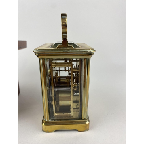 792 - A gilt brass and bevelled glass cased carriage clock, the white enamel dial with Roman numerals, 15c... 