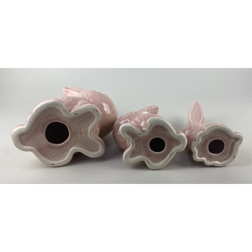 118 - Two Sylvac post 1982 pink glazed models of bunnies comprising no 1027 23cm high and no 1026 17cm, to... 