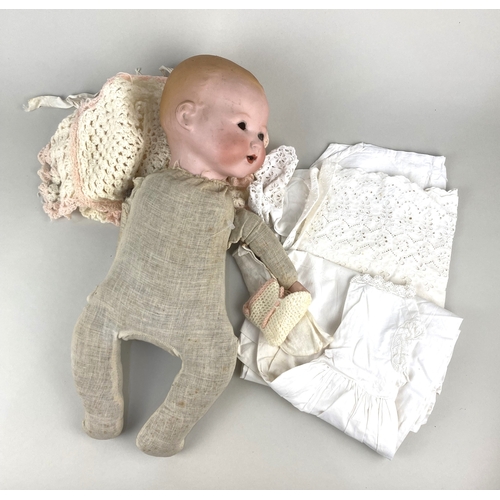 135 - An Armand Marseille bisque head doll marked AM 351/6, on stuffed cloth body (a/f)... 