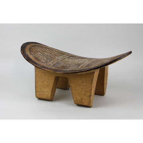 160 - An African carved stool oval top with incised geometric design, on four block feet, 40cm... 