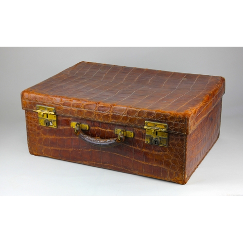 181 - A vintage crocodile leather travel case by Alexander Clark of London, with gilt lettering and stampe... 