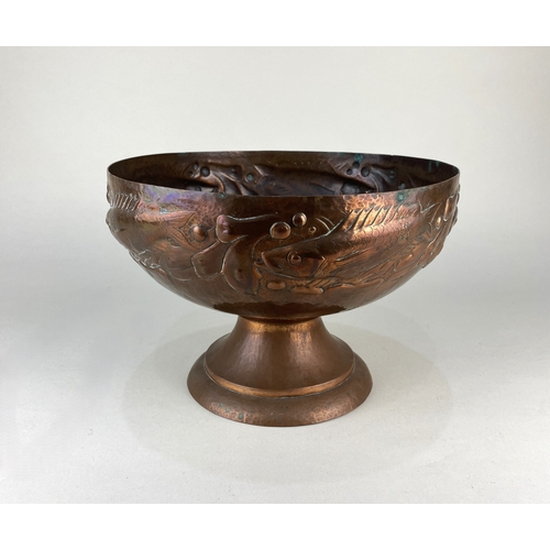 184 - An Arts & Crafts Newlyn copper pedestal bowl decorated with a border of fish, stamped 'Newlyn' t... 