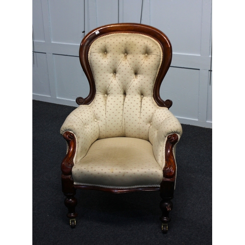 465 - A carved show-wood armchair in the Victorian style, with buttoned patterned fabric upholstery (af)... 