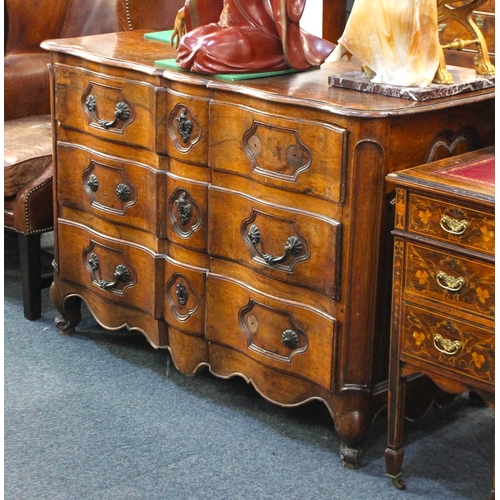 466 - A 18th century French provincial fruitwood shaped front chest of drawers, having three long drawers ... 