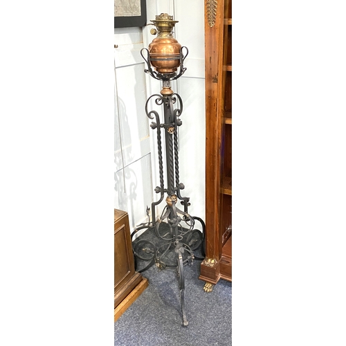 467 - An Art Nouveau wrought iron and copper floor lamp, c.1900, approx 130cm high.... 