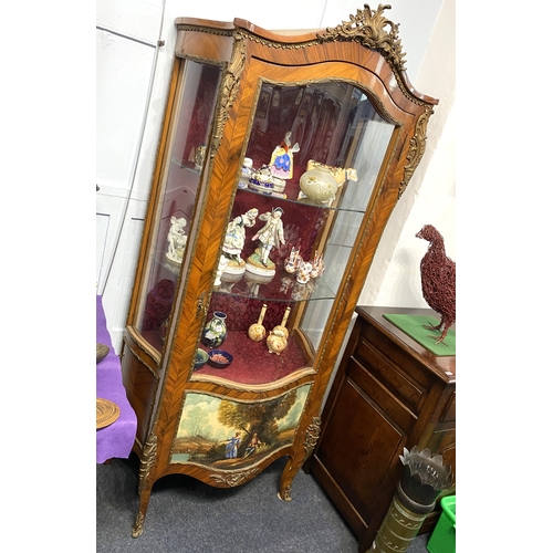 468 - A French gilt metal mounted Vitrine in the Louis XV style with single serpentine shaped glazed door ... 