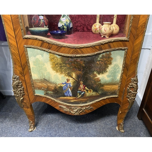 468 - A French gilt metal mounted Vitrine in the Louis XV style with single serpentine shaped glazed door ... 