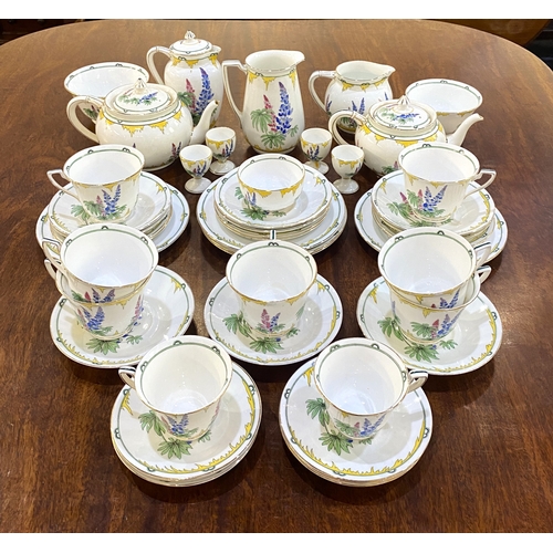 55 - An Addersley 'Lupin' pattern bone china part tea and dinner service exclusive to Harrods, to include... 