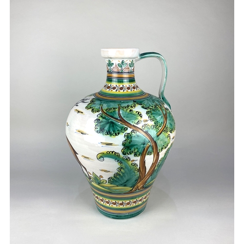 68 - A large majolica style jug / vase decorated with a stag amongst a landscape, inscription to base 49c... 