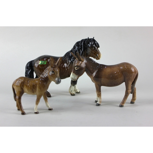 78 - A Beswick model of a Shetland pony 14.5cm, a donkey 11cm, and a donkey foal 11cm... 