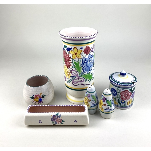 102 - A collection of Poole pottery with floral pattern on white ground, comprising cylinder vase 22cm hig... 