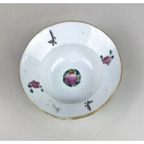 45 - A small Chinese famille rose porcelain bowl, the exterior decorated with butterflies on a pak choi g... 