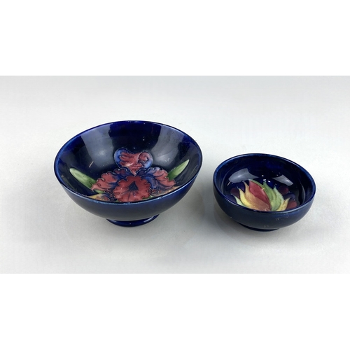 51 - A Moorcroft pottery 'Iris' pattern bowl 11cm diam, and a small Moorcroft pottery 'Leaf and Berry' pa... 