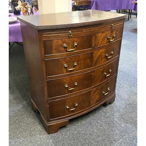 544 - A George III style mahogany bow front chest of drawers with brushing slide, 20th century, the cross ... 