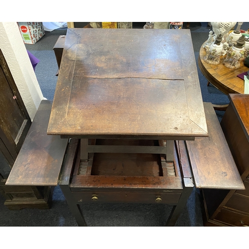 550 - An 18th century mahogany architects table, having a double hinged ratcheted top flanked on either si... 