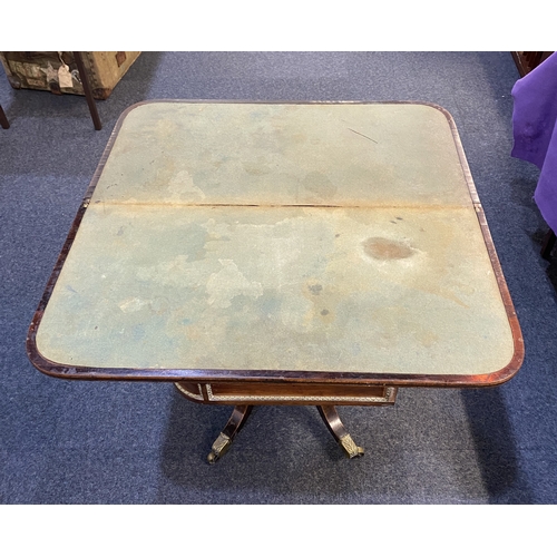 579 - A Regency brass inlaid rosewood card table fold over top with green baize interior and decorative br... 