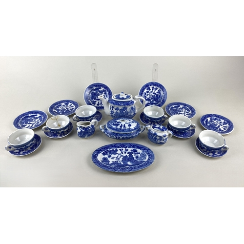 70 - A childrens willow pattern ceramic tea / dinner set comprising tureen and cover, oval platter, six d... 