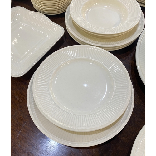 73 - A Wedgwood Queens Ware 'Edme Plain' part dinner and tea service comprising large oval dish, two open... 