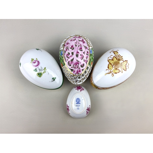 82 - Three large Herend porcelain egg shaped boxes and covers to include a reticulated example with flora... 