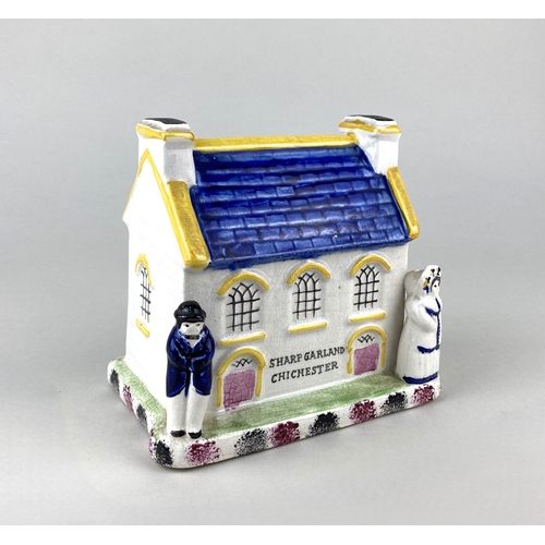 91 - A Prattware ceramic chapel money box, probably Mexborough, Yorkshire, modelled in the form of a chap... 