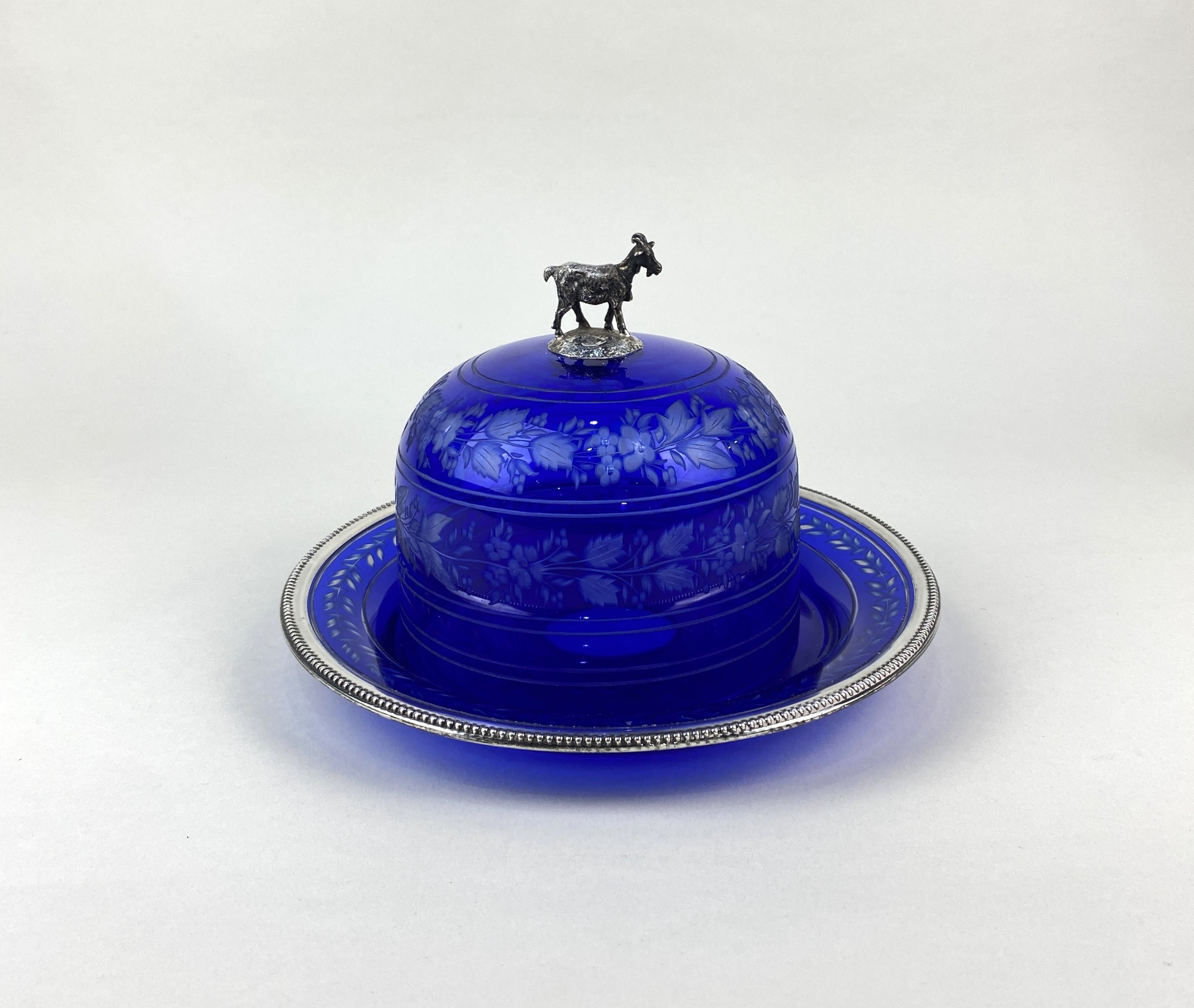 A white metal mounted cobalt cut glass butter dish, possibly French ...