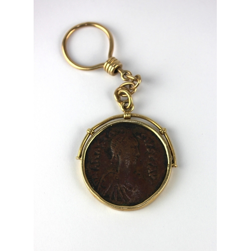 164 - A gold keyring detailed 750 mounted with a Byzantine bronze coin gross weight 28g... 