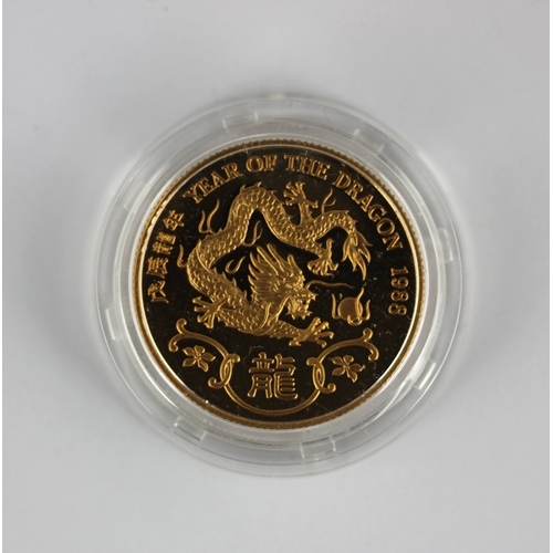 167 - A Hong Kong commemorative gold proof coin detailed the year of the dragon 1988 weight 15.8g with a c... 