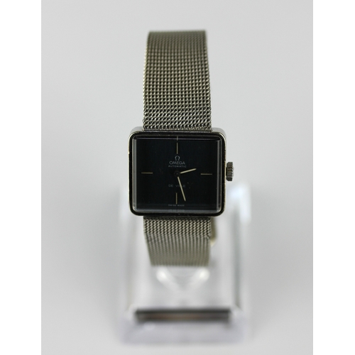 180 - An Omega De Ville steel backed rectangular cased ladys wristwatch the signed rectangular dial with ... 