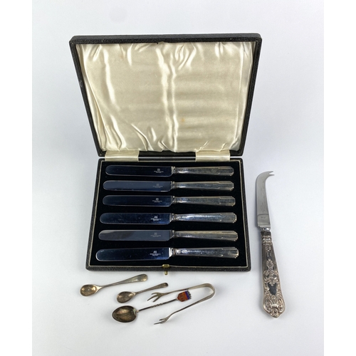 23 - A cased set of six George VI silver handled dessert knives with steel blades, a silver handled chees... 