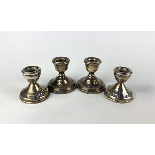 24 - Two pairs of silver miniature candlesticks, weighted bases, A T Cannon Ltd, Birmingham 1971, 7cm hig... 