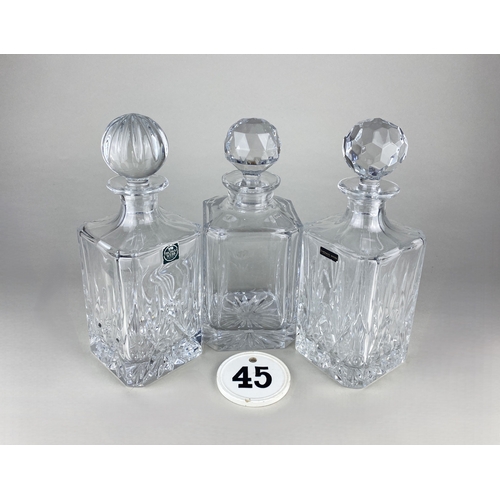 427 - Three cut glass decanters, two with labels for Thomas Webb (stoppers possibly matched), and a cerami... 