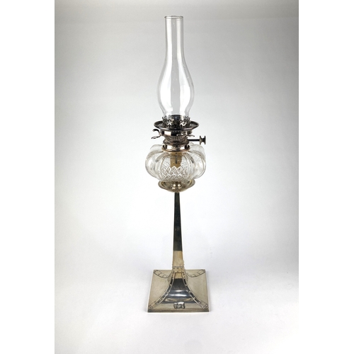 43 - An Arts & Crafts silver oil lamp by James Dixon & Sons, with glass reservoir and glass chimn... 