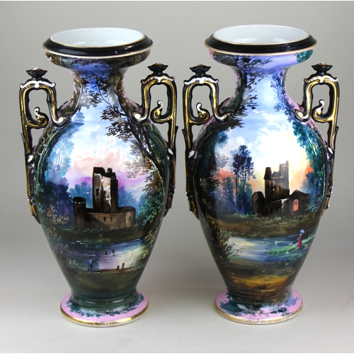 431 - A pair of large two-handled vases baluster shape decorated in shades of lilac and blue with woodland... 