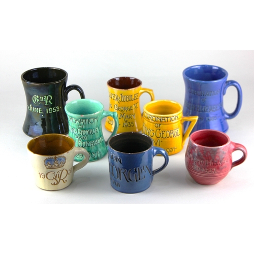 441 - Eight George V and later Devonshire art pottery Royal Commemorative mugs to include a C H Brannam Ba... 