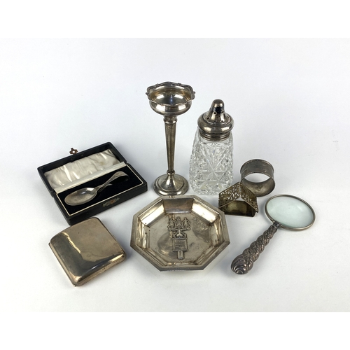 46 - A collection of small silver items: comprising a cigarette case, two napkin rings, a cased Christeni... 