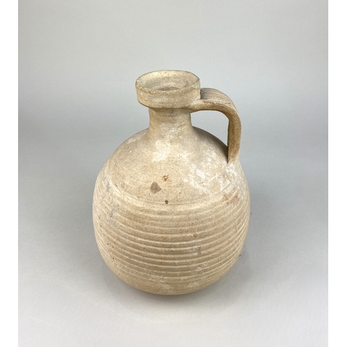 468 - A terracotta buff ware single handled flask, believed to be Roman circa.2nd century, bears label sta... 