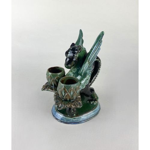 473 - A CH Brannam Barum dragon chamberstick with twin sconces, dated 1899, glazed in brown, green and blu... 