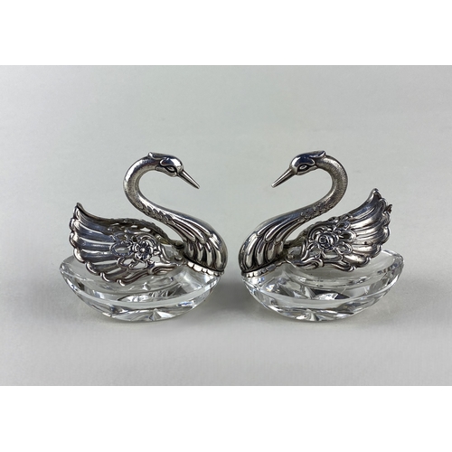 48 - A pair of silver and cut glass swans, with pierced and embossed pivoting wings, stamped 925, 7cm hig... 