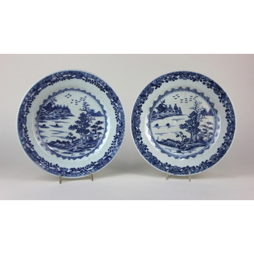 496 - A pair of 18th century Chinese blue and white porcelain plates, painted underglaze with central rive... 