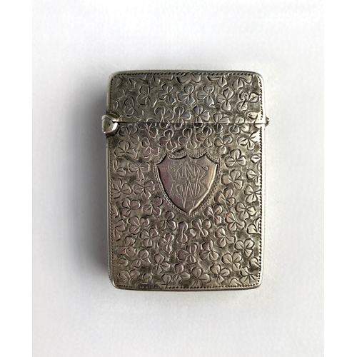 61 - A Victorian silver vesta case, maker JG, Birmingham probably 1882, monogram engraved shield shaped c... 