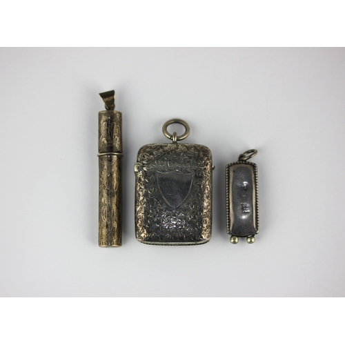 77 - A Victorian silver vesta case with engraved decoration, Birmingham 1897. A silver mounted folding ci... 