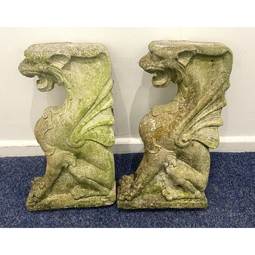 828 - A pair of reconstituted stone 'Griffin' garden ornaments / or could make the bases for a garden seat... 