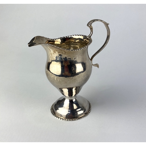 97 - A George III silver cream jug, maker 'WS', London 1817, 10cm high, approx 2.75ozs.