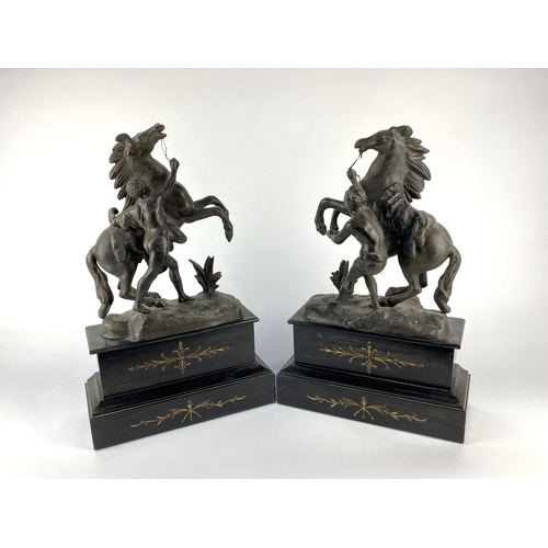 127 - A pair of 19th century Marley Horses figures, modelled after Guillame Coustou, mounted as a garnitur... 